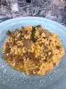 Risotto con crema di taleggio, carne di "Iberico" e zucca al rosmarino